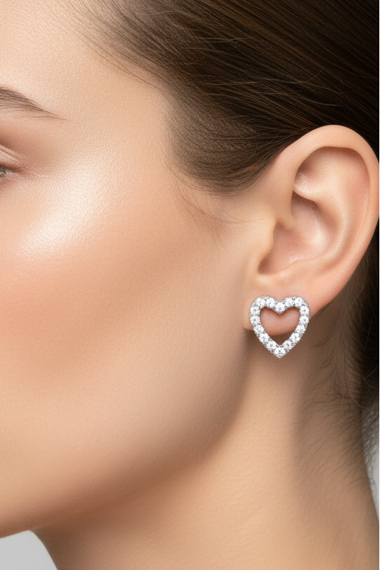 Model wearing heart-shaped earrings